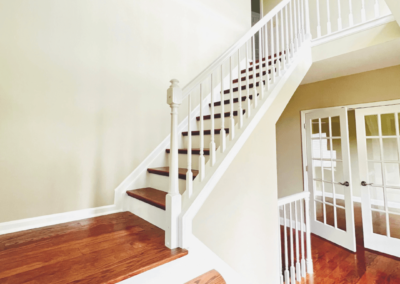 white stairway bannister